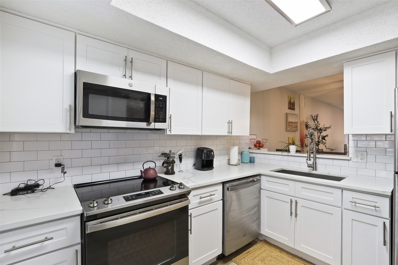 Renovated kitchen with quartz countertops